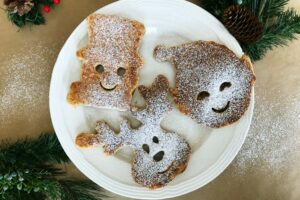 Ho Ho Holiday Pancakes | blowingawayoutwest.com - Molded Christmas Pancakes, perfect for a holiday brunch #christmaspancakes #holidaypancakes #christmaspancakesforkids #christmasmorningbreakfast #12daysofChristmas