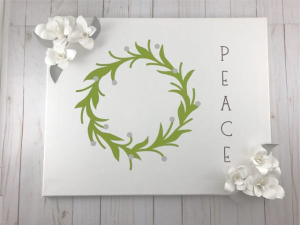 Magnolia Wreath Canvas.  DIY Magnolia Wreath Canvas Tutorial Using Your Cricut | craftingismytherapy.com -  #christmasdiy #christmasdiydecor #christmasroundup #christmasideas #christmasgames #christmascraft #christmaswreath #magnoliawreath #canvasart #DIYchristmas