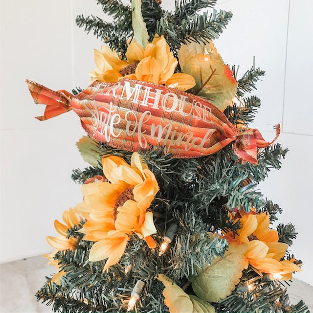 DIY Sunflower Christmas Tree | craftingismytherapy.com - Tutorial for making a Sunflower Christmas Tree wrapped in Farmhouse Saying on Ribbon. #christmastree #christmastreedecorations #sunflowerchristmastree #sunflowertree #holidaytree #christmasdisplay #12daysofchristmasideas #farmhousechristmas #farmhousechristmastree