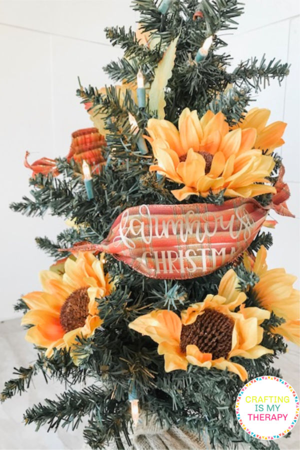 DIY Sunflower Christmas Tree | craftingismytherapy.com - Tutorial for making a Sunflower Christmas Tree wrapped in Farmhouse Saying on Ribbon. #christmastree #christmastreedecorations #sunflowerchristmastree #sunflowertree #holidaytree #christmasdisplay #12daysofchristmasideas #farmhousechristmas #farmhousechristmastree